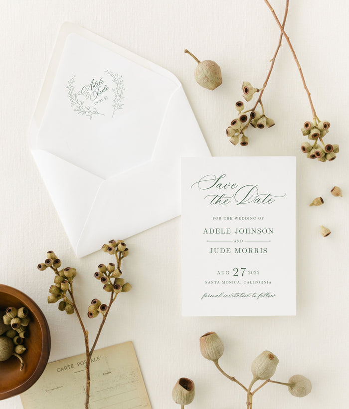 Simple, formal wedding save the date with a custom wreath and elegant calligraphy